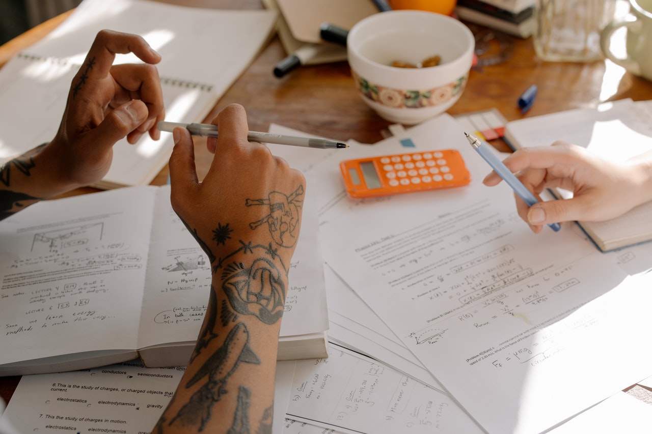 Two people using AI for Maths homework to help with their tasks