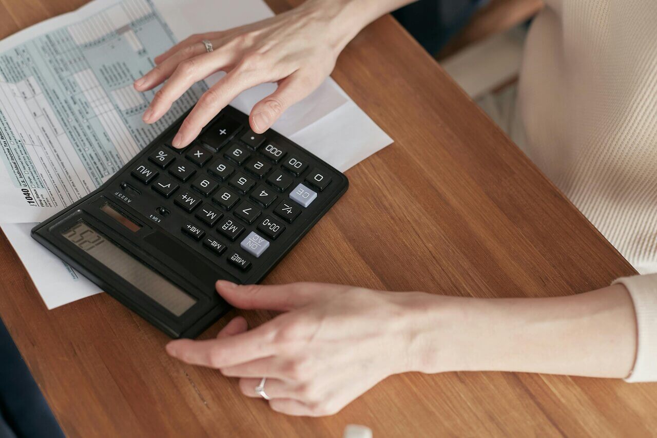 Hands using calculator 